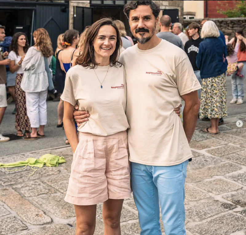 Ernest and Marisa, owners of The Neighbourhood, outside the wine bar on a summer evening